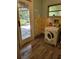 Laundry room featuring a washer and wood flooring at 20045 Sw 88Th Place Rd, Dunnellon, FL 34431