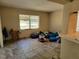 Cozy living room bathed in natural light showcasing neutral tones and modern tiled floors at 20045 Sw 88Th Place Rd, Dunnellon, FL 34431