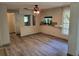 Bright living room featuring a unique ceiling fan and an open concept layout at 20045 Sw 88Th Place Rd, Dunnellon, FL 34431