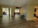 The living room features wood flooring, a pass-through to the kitchen and sliding glass doors leading to the outdoor area at 20045 Sw 88Th Place Rd, Dunnellon, FL 34431