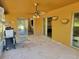Screened in patio with a ceiling fan at 20045 Sw 88Th Place Rd, Dunnellon, FL 34431
