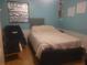Bedroom with blue walls and a white bed at 2312 Ne 37Th St, Ocala, FL 34479