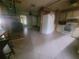 Spacious kitchen featuring tile flooring and white appliances at 2312 Ne 37Th St, Ocala, FL 34479