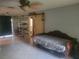 Comfortable living room featuring a daybed, industrial shelving and sliding barn door to the bathroom at 2312 Ne 37Th St, Ocala, FL 34479