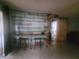 This office area is accented by custom wood shelving and a rustic barn door at 2312 Ne 37Th St, Ocala, FL 34479
