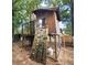 Backyard treehouse with climbing wall feature at 2312 Ne 37Th St, Ocala, FL 34479