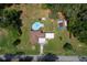 Bird's eye view showcases the sparkling blue pool and the property's generous outdoor space at 2340 Ne 14Th Ave, Ocala, FL 34470