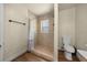 Bright bathroom featuring a tiled shower and neutral color palette at 2340 Ne 14Th Ave, Ocala, FL 34470