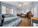 Bright bedroom with hardwood floors, natural light, and comfortable seating area at 2340 Ne 14Th Ave, Ocala, FL 34470