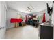 Bedroom with a loft bed, ceiling fan, desk, and windows at 2340 Ne 14Th Ave, Ocala, FL 34470
