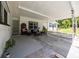 Well-lit carport offers a shaded spot for parking and provides an inviting lounge space at 2340 Ne 14Th Ave, Ocala, FL 34470