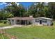 Charming single-story home with a spacious front yard and convenient covered carport at 2340 Ne 14Th Ave, Ocala, FL 34470