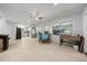 Bright living room featuring a dining area, large windows, and sleek flooring throughout at 2340 Ne 14Th Ave, Ocala, FL 34470
