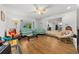 Bright living room with hardwood floors and plenty of comfortable seating, adjacent to dining area at 2340 Ne 14Th Ave, Ocala, FL 34470