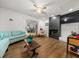 Cozy living room with hardwood floors, a fireplace, and ample natural light at 2340 Ne 14Th Ave, Ocala, FL 34470