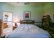 Serene bedroom with soft tones, ensuite bathroom, and a restful ambiance at 3146 Williams Rd, The Villages, FL 32162
