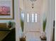 Bright foyer with tile flooring, decorative plants, and natural light that enhance the home's welcoming ambiance at 3146 Williams Rd, The Villages, FL 32162
