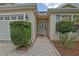 Charming front entrance with a brick pathway, a well maintained lawn and a welcoming entryway at 3146 Williams Rd, The Villages, FL 32162