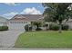 Charming home featuring a well-maintained front yard and spacious two-car garage at 3146 Williams Rd, The Villages, FL 32162