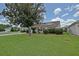 Well-maintained single-story home with lush lawn and mature landscaping at 3146 Williams Rd, The Villages, FL 32162