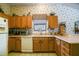 Spacious kitchen with wood cabinets and modern appliances for cooking at 3146 Williams Rd, The Villages, FL 32162