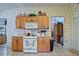 Well-equipped kitchen with ample counter space and wooden cabinetry at 3146 Williams Rd, The Villages, FL 32162