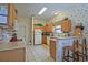 Bright kitchen featuring ample counter space and an island with seating at 3146 Williams Rd, The Villages, FL 32162