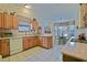 Functional kitchen with wood cabinets and a breakfast nook area for casual dining at 3146 Williams Rd, The Villages, FL 32162