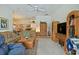 Cozy living room featuring comfortable seating and decorative wooden furniture at 3146 Williams Rd, The Villages, FL 32162