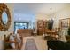 Open-concept living and dining area with plenty of natural light, creates a comfortable and inviting space at 3146 Williams Rd, The Villages, FL 32162