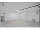 Spacious two-car garage with overhead lighting and block construction at 3268 Sw 149Th Pl, Ocala, FL 34481