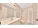 Full bathroom featuring a shower-tub combo with white tile surround and white single sink vanity at 3707 Ne 17Th St, Ocala, FL 34470