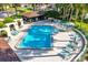 Community pool with plenty of poolside seating and a covered lounge area at 3707 Ne 17Th St, Ocala, FL 34470