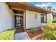 Welcoming townhome entrance featuring clean lines, an ornate door grill, and tidy landscaping at 3707 Ne 17Th St, Ocala, FL 34470