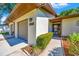 Close-up of a well-maintained townhome with an attached garage and tidy front yard at 3707 Ne 17Th St, Ocala, FL 34470
