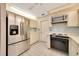 Kitchen with updated stainless steel refrigerator and range in a brightly lit space at 3707 Ne 17Th St, Ocala, FL 34470