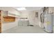 Utility room featuring washer, dryer, storage shelves, and access to the main house at 3707 Ne 17Th St, Ocala, FL 34470