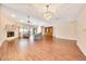 Open-concept living room featuring a fireplace, wood floors, ceiling fans, and recessed lighting at 3707 Ne 17Th St, Ocala, FL 34470