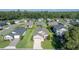 Aerial view of a home with manicured lawn in a residential neighborhood with mature trees at 3948 Se 4Th Ter, Ocala, FL 34480