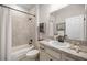 Clean bathroom with tub shower combo and decorative seashell accents at 3948 Se 4Th Ter, Ocala, FL 34480