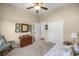 Bright bedroom featuring a ceiling fan, a closet, and cozy decor at 3948 Se 4Th Ter, Ocala, FL 34480