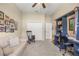Cozy bedroom with neutral tones, comfortable seating, and charming equestrian-themed decor at 3948 Se 4Th Ter, Ocala, FL 34480