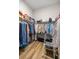 Spacious walk-in closet with ample storage and wooden floors at 3948 Se 4Th Ter, Ocala, FL 34480