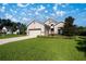 Charming home with lush green lawn, complemented by a well-maintained landscape at 3948 Se 4Th Ter, Ocala, FL 34480