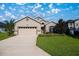 Well-maintained one-story home with a two-car garage, manicured lawn and beautiful landscaping at 3948 Se 4Th Ter, Ocala, FL 34480