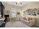 Comfortable home office with desk, couch, and natural light at 3948 Se 4Th Ter, Ocala, FL 34480