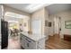 Open concept kitchen featuring granite countertops and center island at 3948 Se 4Th Ter, Ocala, FL 34480