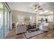 Living room featuring wood floors, comfortable seating, and access to the patio at 3948 Se 4Th Ter, Ocala, FL 34480