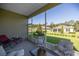 Relaxing screened-in lanai with outdoor seating, offering beautiful backyard views and fresh air at 3948 Se 4Th Ter, Ocala, FL 34480
