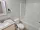 Sparkling bathroom with granite counters, white cabinets, and shower/tub combo at 5185 Sw 158Th Pl, Ocala, FL 34473